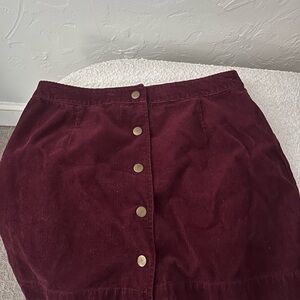Burgundy corduroy skirt with buttons down the front